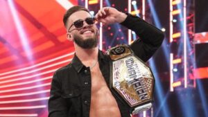 Austin Theory WWE Superstar posing with championship belt